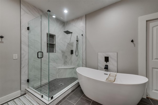 bathroom with separate shower and tub and tile patterned flooring