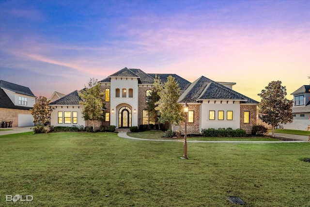 view of front of property with a yard