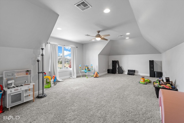 rec room with ceiling fan, lofted ceiling, and carpet floors