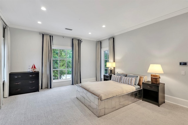 bedroom featuring crown molding and light colored carpet