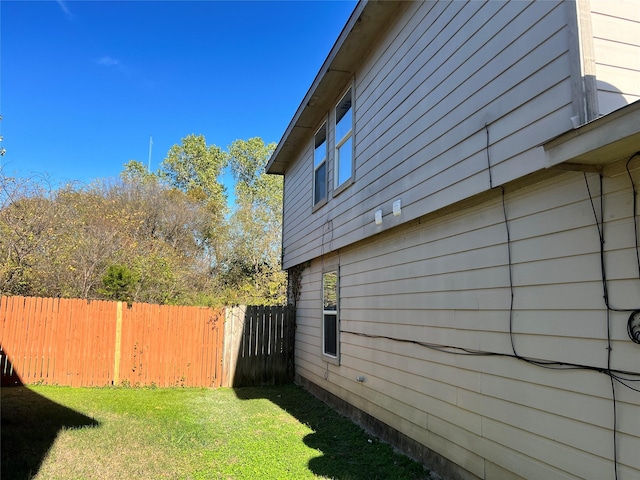 view of property exterior featuring a yard