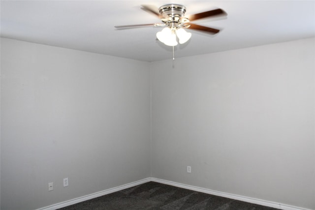 empty room featuring dark colored carpet and ceiling fan