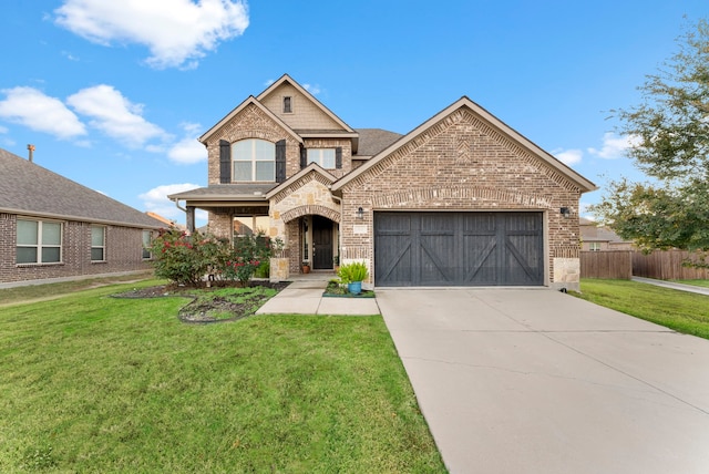 view of front of house featuring a front yard and a garage