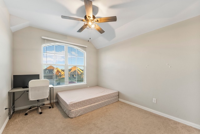 carpeted bedroom featuring vaulted ceiling and ceiling fan