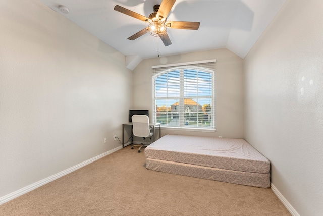 unfurnished bedroom featuring ceiling fan, light colored carpet, and lofted ceiling