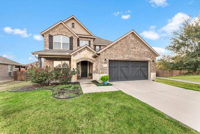 view of front of property featuring a garage and a front lawn