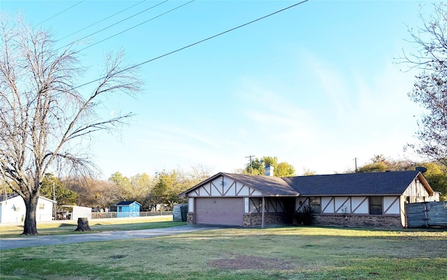 view of front facade with a garage and a front lawn