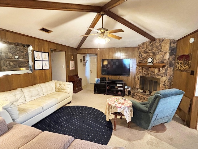 living room with light carpet, ceiling fan, lofted ceiling with beams, a fireplace, and wood walls