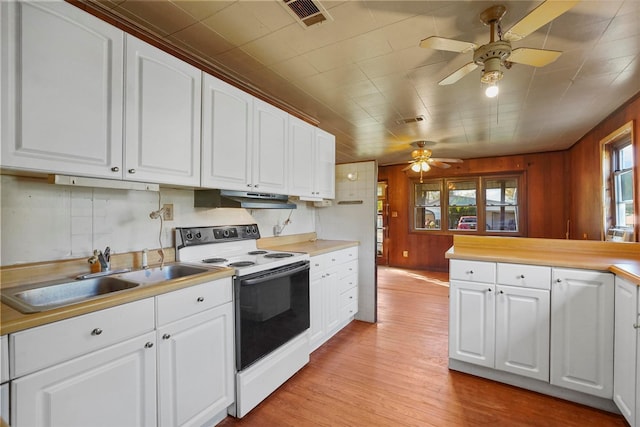 kitchen featuring white electric range, sink, light wood-type flooring, ceiling fan, and white cabinets