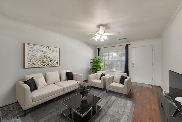 living room featuring dark wood-type flooring, ceiling fan, and ornamental molding