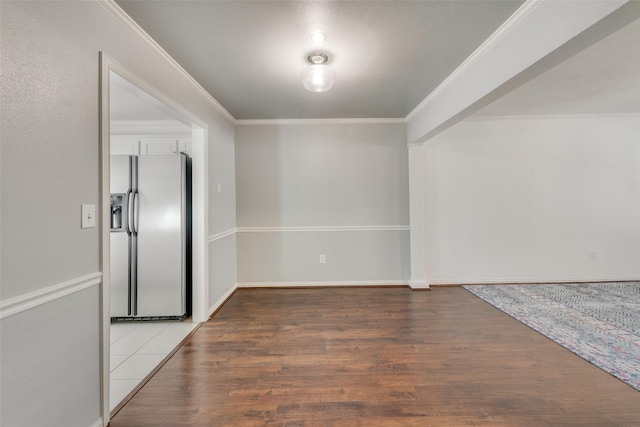 interior space with ornamental molding and hardwood / wood-style flooring