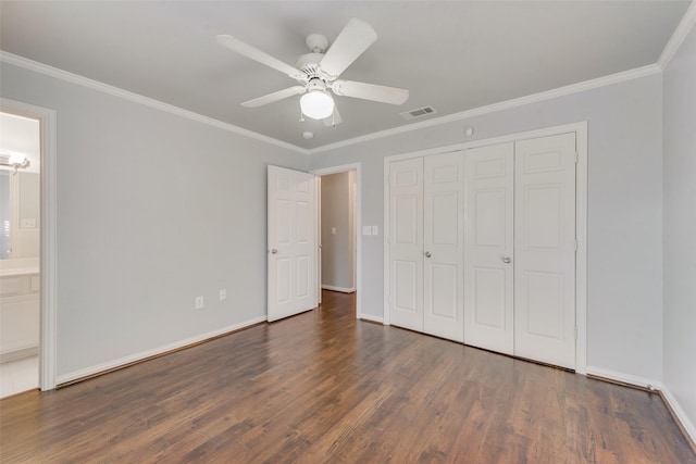 unfurnished bedroom featuring dark hardwood / wood-style flooring, connected bathroom, ceiling fan, and ornamental molding