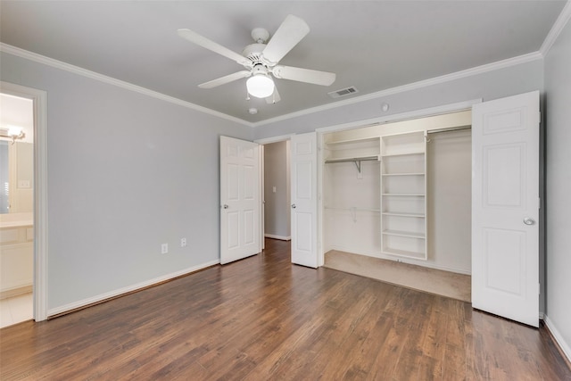 unfurnished bedroom with ensuite bath, ceiling fan, dark hardwood / wood-style flooring, and crown molding