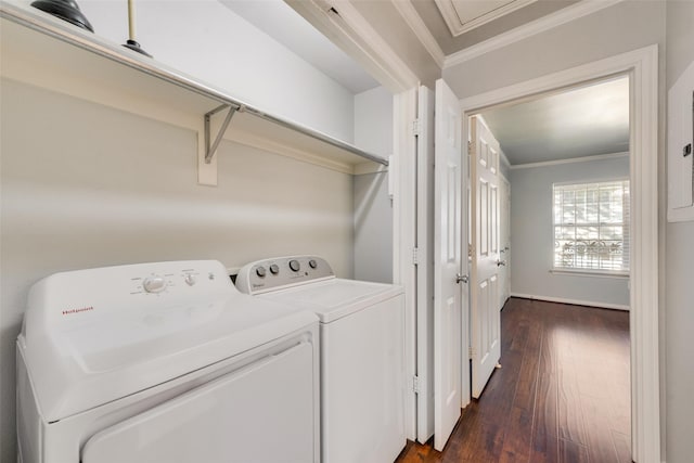 laundry room with independent washer and dryer, dark hardwood / wood-style flooring, and ornamental molding