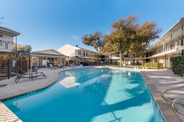 view of swimming pool with a patio