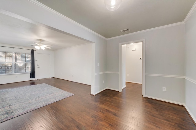 empty room featuring ceiling fan, dark hardwood / wood-style floors, and ornamental molding