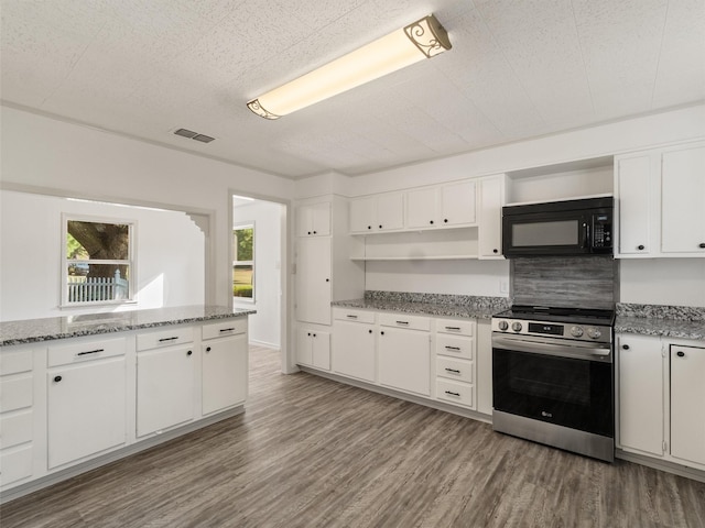 kitchen featuring white cabinets, dark hardwood / wood-style floors, light stone counters, and stainless steel range