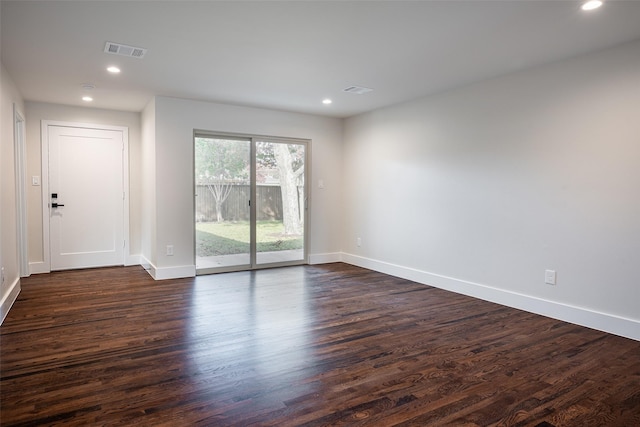 unfurnished room featuring dark hardwood / wood-style flooring