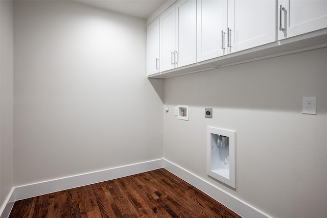 clothes washing area with dark wood finished floors, hookup for a washing machine, cabinet space, electric dryer hookup, and baseboards