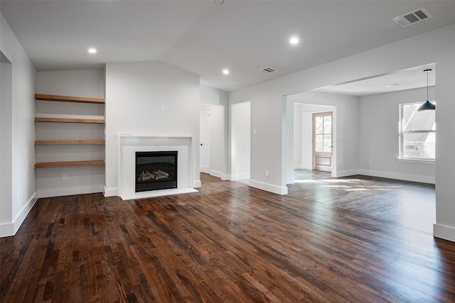 unfurnished living room with lofted ceiling and dark hardwood / wood-style floors