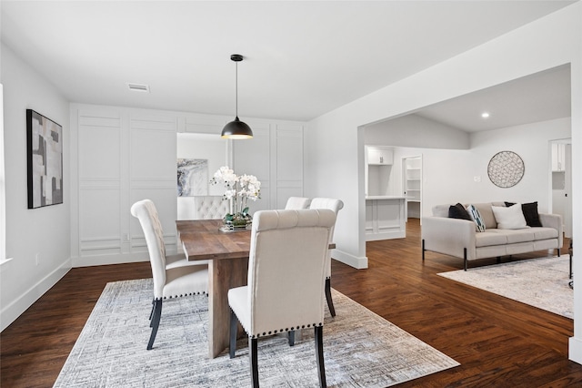 dining area with dark wood-style flooring, recessed lighting, visible vents, and baseboards