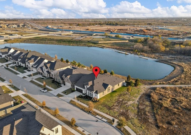 drone / aerial view with a water view