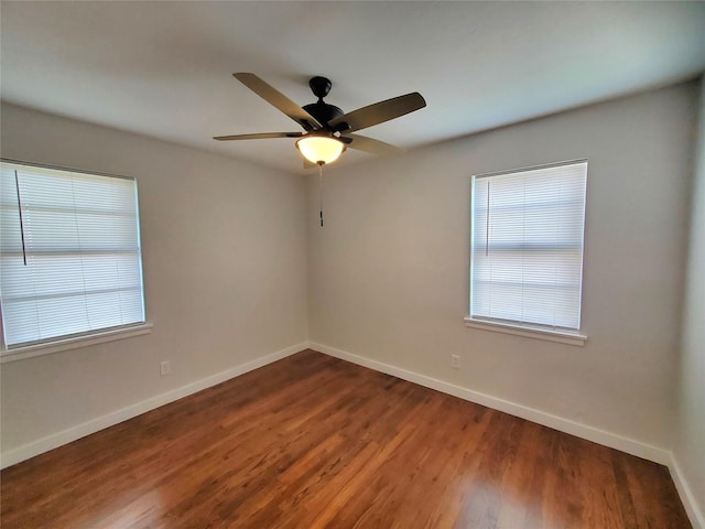 unfurnished room with hardwood / wood-style flooring, a wealth of natural light, and ceiling fan