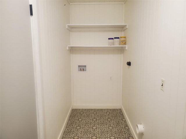 laundry room with wooden walls and hookup for a washing machine