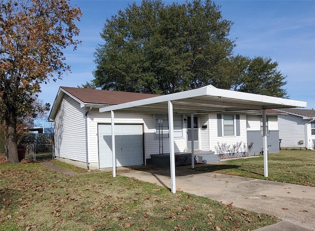 ranch-style house with a front lawn, a carport, and a garage