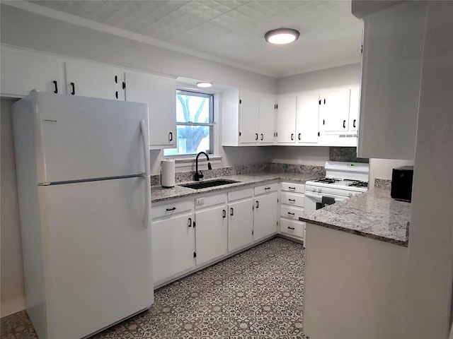 kitchen with white cabinets, light stone countertops, white appliances, and sink