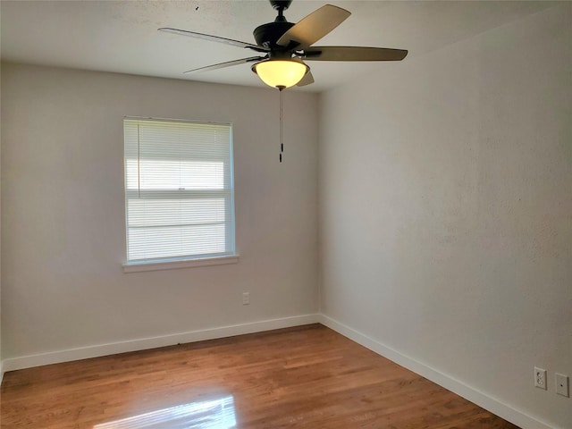 unfurnished room featuring ceiling fan and light wood-type flooring