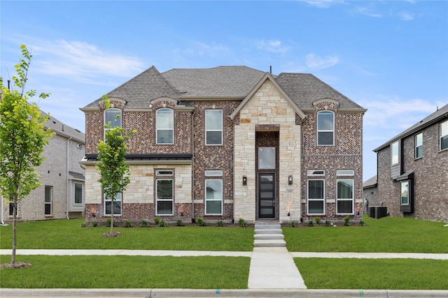 1347 Overton St, Frisco, TX 75036 - french country home with a front yard, central air condition unit, roof with shingles, and stone siding