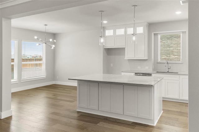 1347 Overton St, Frisco, TX 75036 - kitchen with a sink, white cabinets, recessed lighting, and baseboards