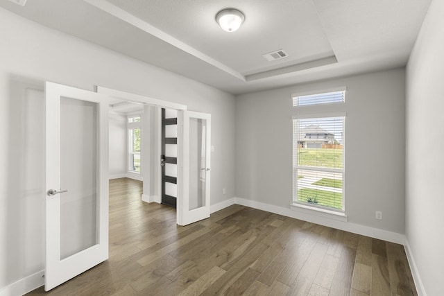 1347 Overton St, Frisco, TX 75036 - spare room featuring french doors, healthy amount of natural light, and baseboards