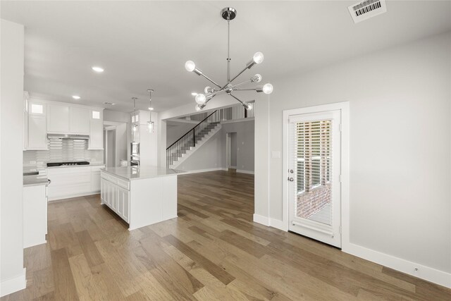 1347 Overton St, Frisco, TX 75036 - kitchen with white cabinets, light wood-style flooring, baseboards, and recessed lighting