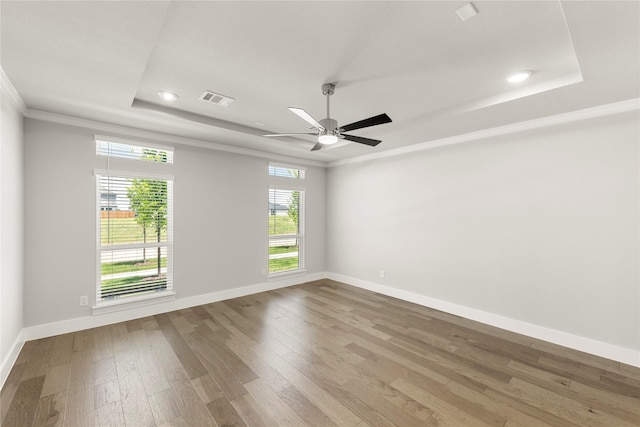 1347 Overton St, Frisco, TX 75036 - unfurnished room with a tray ceiling, crown molding, wood finished floors, baseboards, and recessed lighting