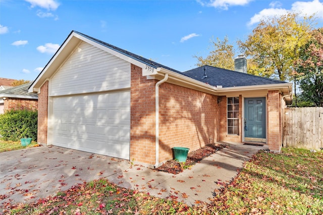 single story home featuring a garage