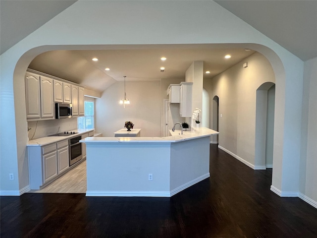 unfurnished living room featuring ceiling fan, high vaulted ceiling, wood-type flooring, and a brick fireplace