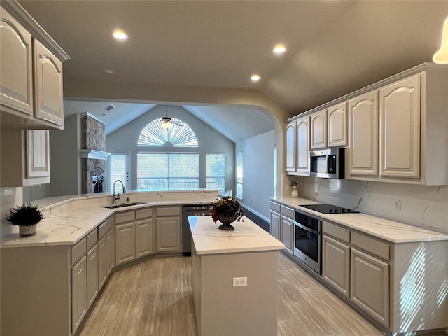 kitchen with gray cabinets, kitchen peninsula, and sink