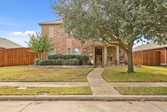 view of front of home featuring a front lawn