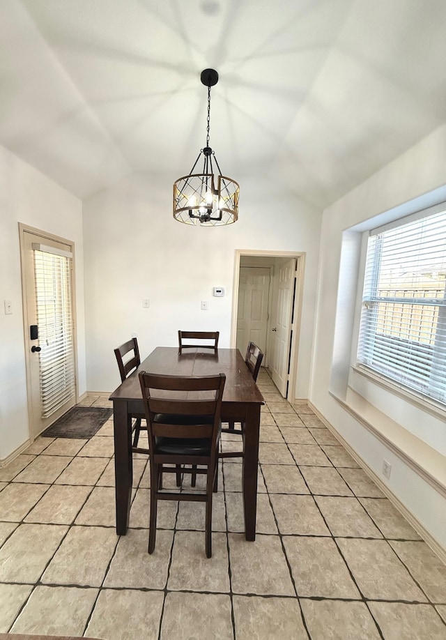1700 Warm Springs Dr, Allen, TX 75002 - dining area with an inviting chandelier, light tile patterned floors, and lofted ceiling