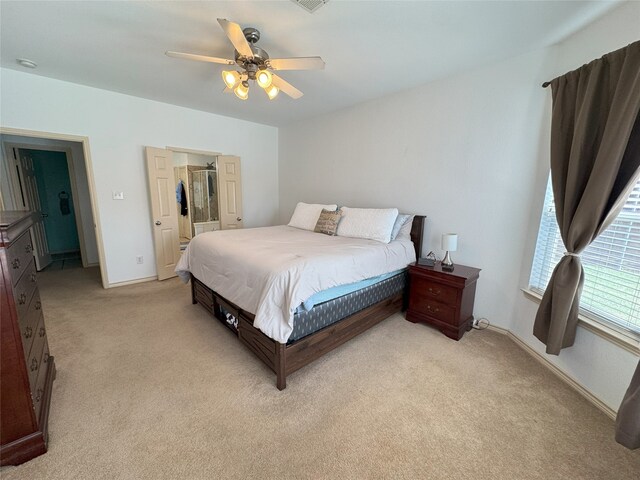 1700 Warm Springs Dr, Allen, TX 75002 - bedroom with a walk in closet, visible vents, baseboards, ceiling fan, and light colored carpet