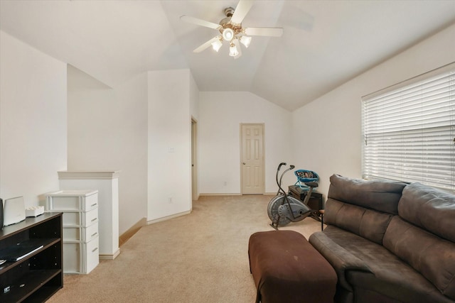 living room featuring light carpet, vaulted ceiling, and ceiling fan