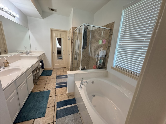 1700 Warm Springs Dr, Allen, TX 75002 - bathroom with double vanity, a stall shower, a garden tub, and a sink
