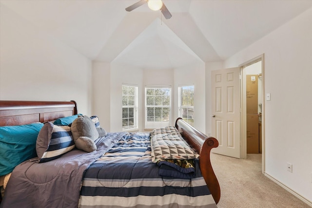 bedroom with ceiling fan, light colored carpet, and lofted ceiling