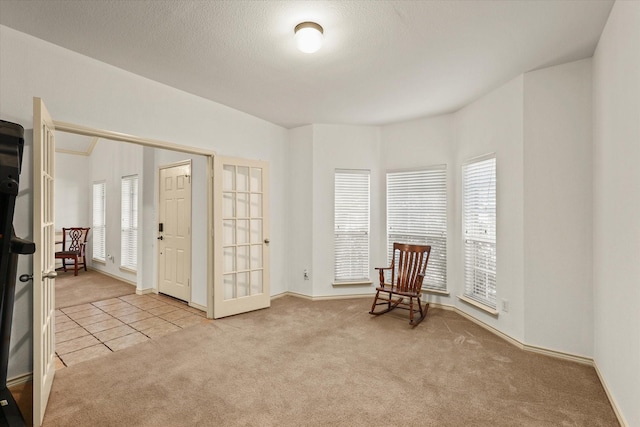 1700 Warm Springs Dr, Allen, TX 75002 - sitting room with carpet floors, french doors, and baseboards