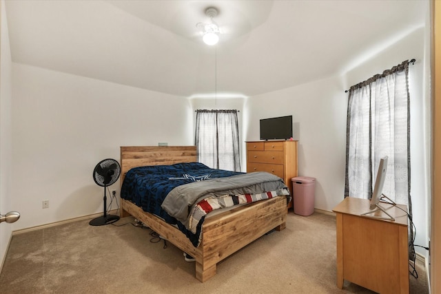 bedroom featuring light carpet