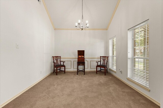 sitting room with carpet flooring, a notable chandelier, crown molding, and high vaulted ceiling