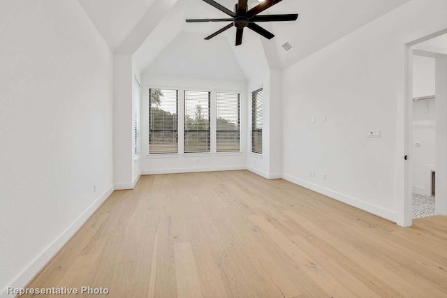 interior space with vaulted ceiling, ceiling fan, and light hardwood / wood-style flooring