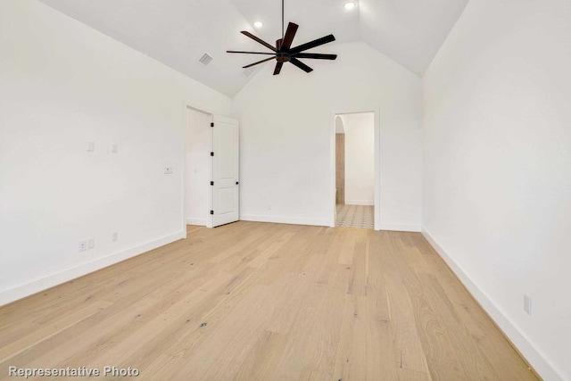 unfurnished room with ceiling fan, high vaulted ceiling, and light hardwood / wood-style flooring